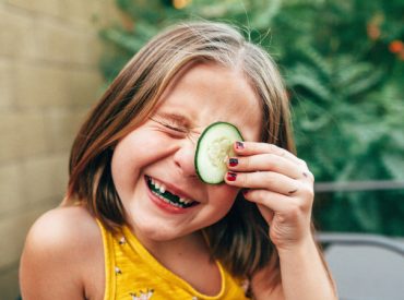 Canva-Cute-girl-with-cucumber-on-the-eye-1